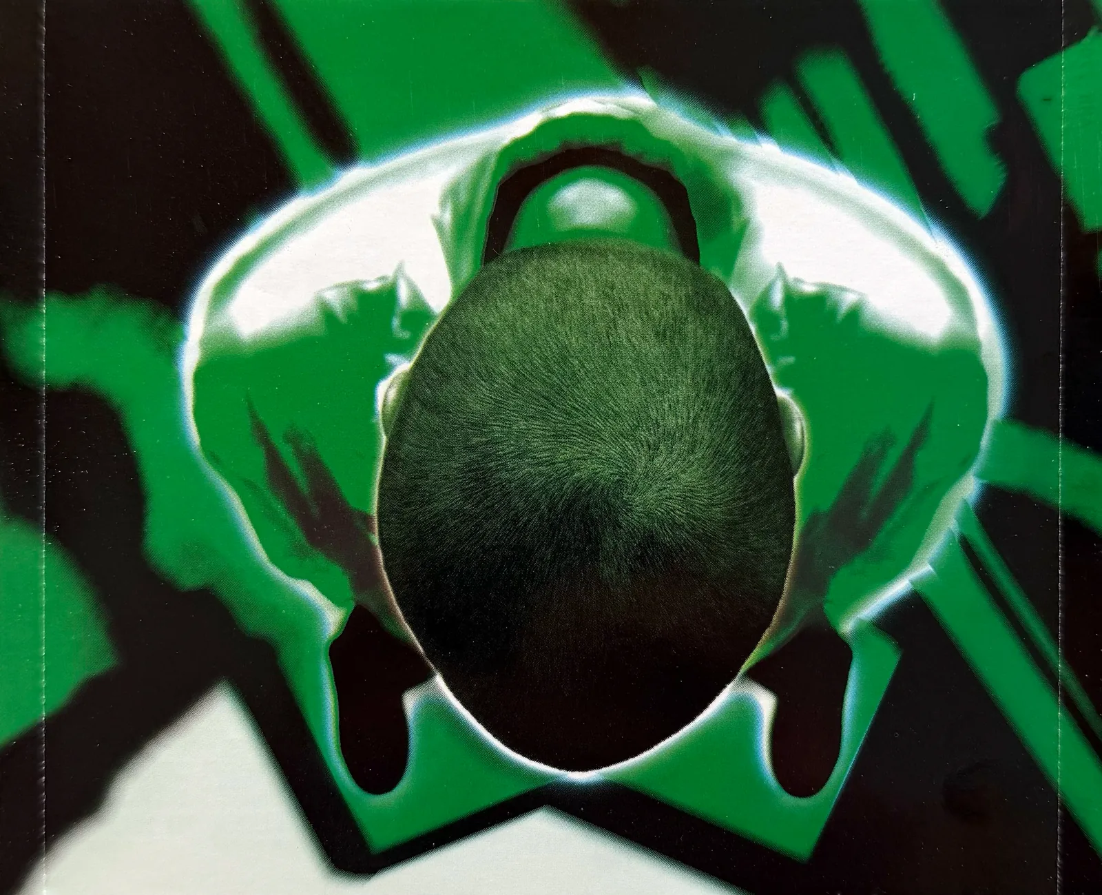 Poppaloopa tray insert: green-tinted overhead photo of the top of Kef’s head, seen under the disc
